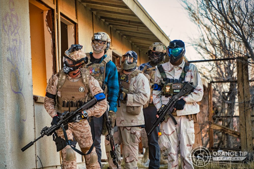 Airsoft players preparing to breach a building