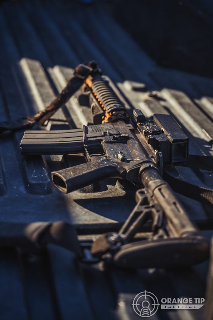 an airsoft rifle in the bed of a truck